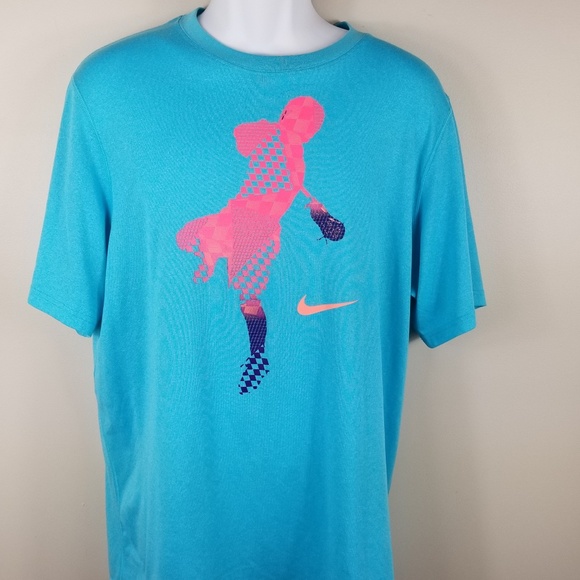 pink and turquoise nike shirt